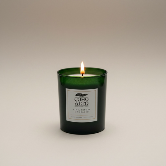 Candle with a label on a beige background