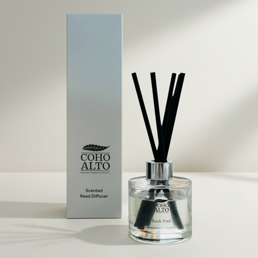 Coho Alto scented reed diffuser with packaging on a light background