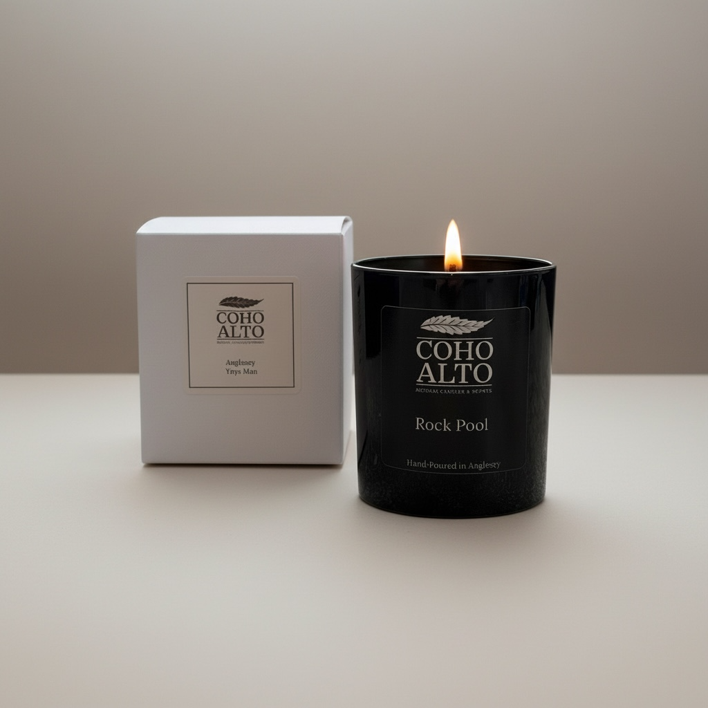 Coho Alto candle and packaging on a neutral background
